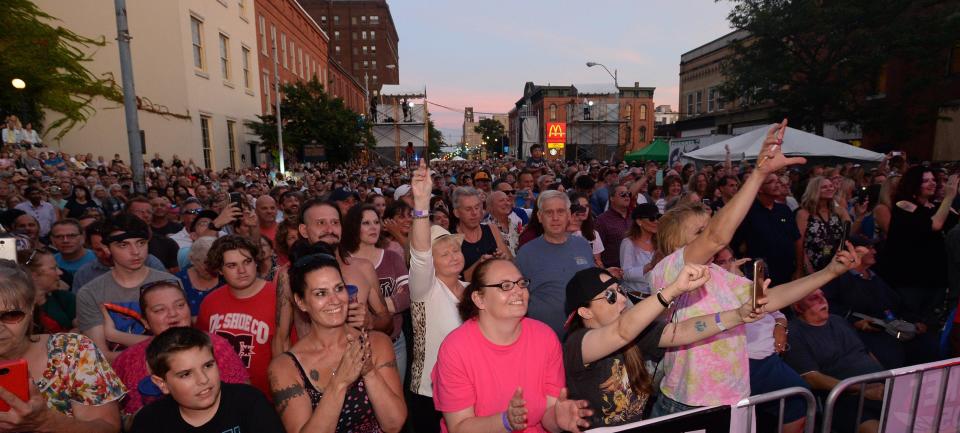 A crowd packs downtown Erie during CelebrateErie 2019 as the Erie All-Stars band performs their tribute to the rock band Queen. Numerous free concerts are scheduled in the area for summer 2023.