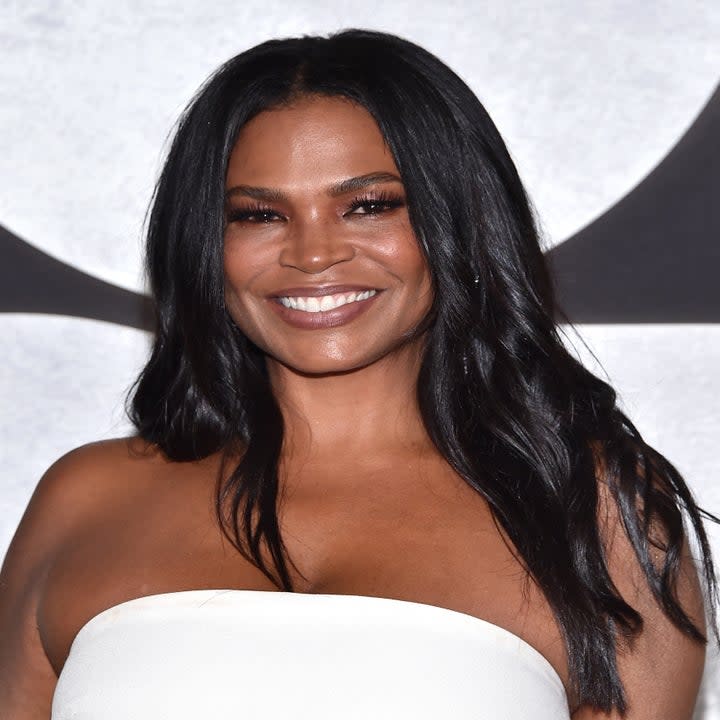 Close-up of Nia Long smiling in a strapless outfit