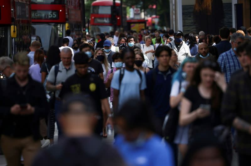 FILE PHOTO: People walk along Oxford Street, amid the coronavirus disease (COVID-19) outbreak, in London