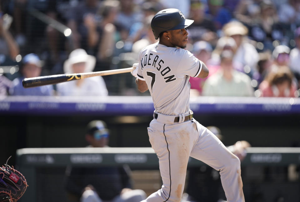 Chicago White Sox's Tim Anderson hits an RBI-single off Colorado Rockies relief pitcher Lucas Gilbreath in the seventh inning of a baseball game Wednesday, July 27, 2022, in Denver. (AP Photo/David Zalubowski)