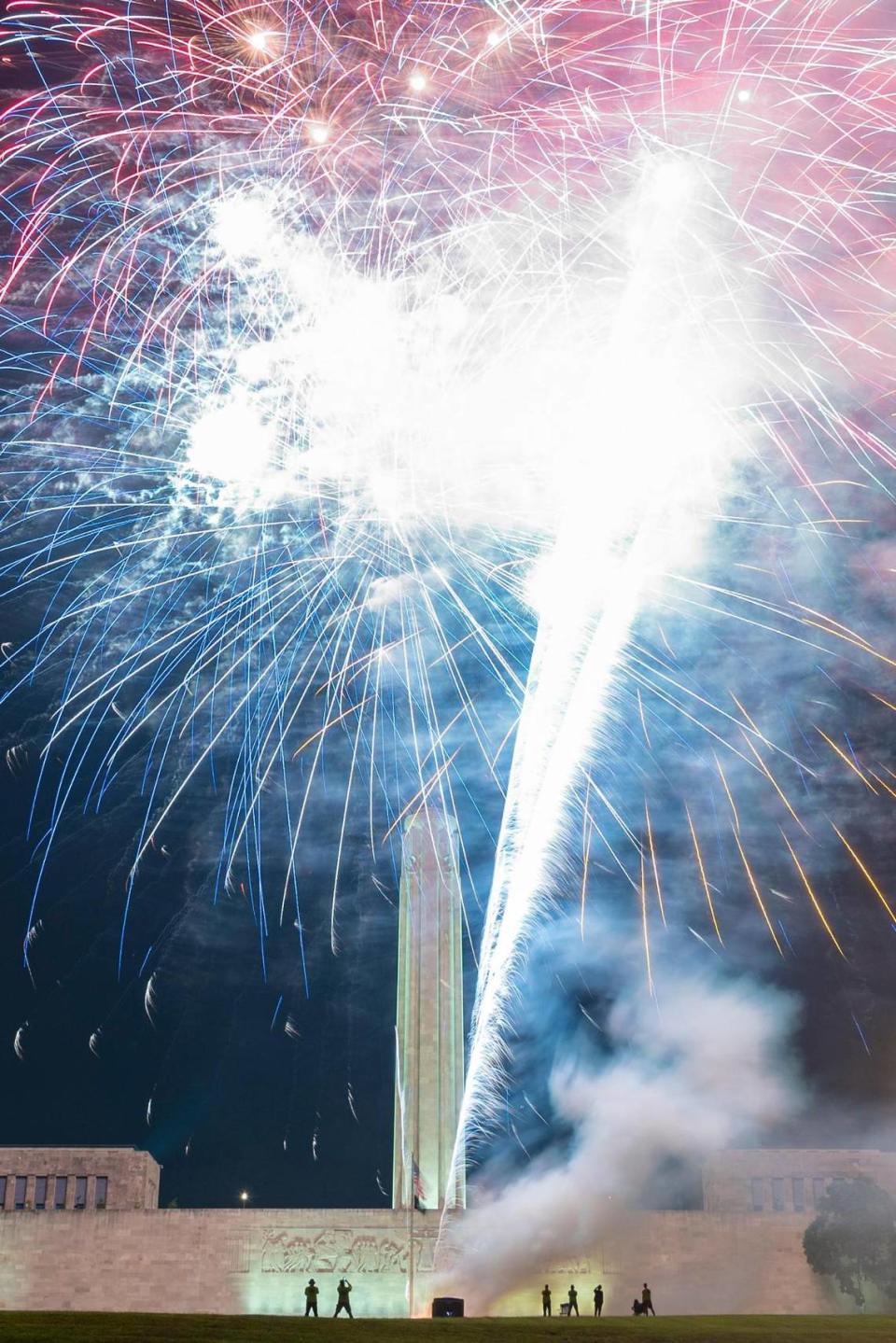 People gather to watch a fireworks show put on by the National World War 1 Museum and Memorial after the Stars and Stripes Picnic on July 2, 2022, in Kansas City