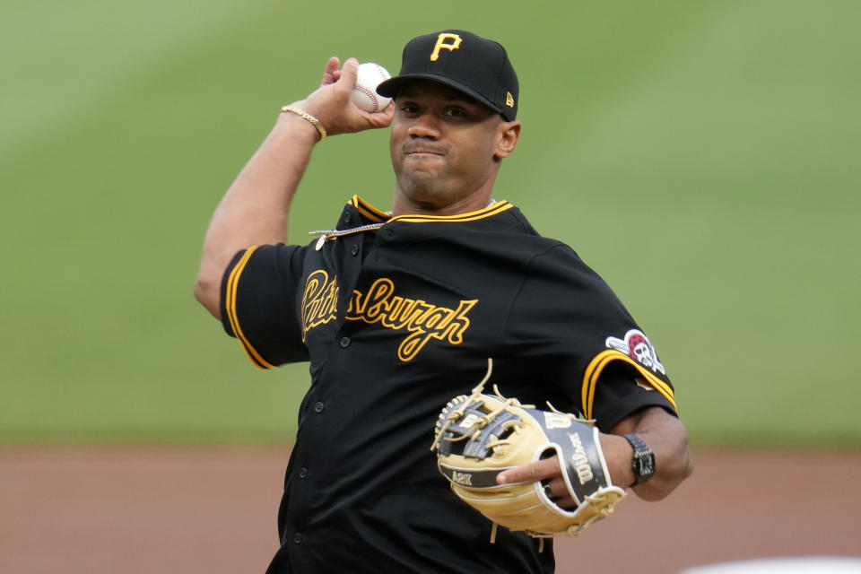 Pittsburgh Steelers quarterback Russell Wilson throws a ceremonial first pitch before a baseball game between the Pittsburgh Pirates and the Boston Red Sox in Pittsburgh, Friday, April 19, 2024. (AP Photo/Gene J. Puskar)