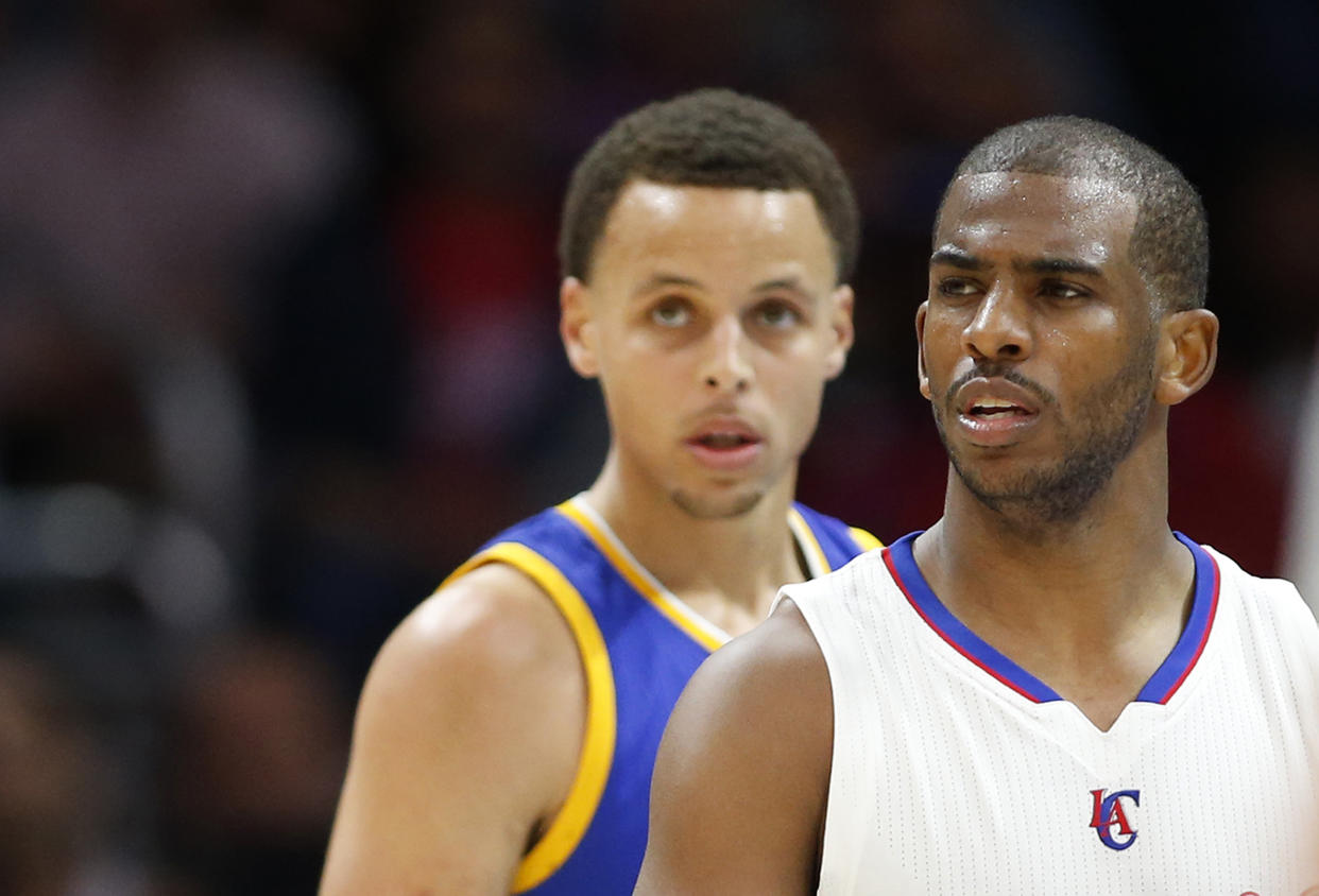 Plenty of time has passed since Stephen Curry and Chris Paul were bitter rivals. (AP Photo/Danny Moloshok)