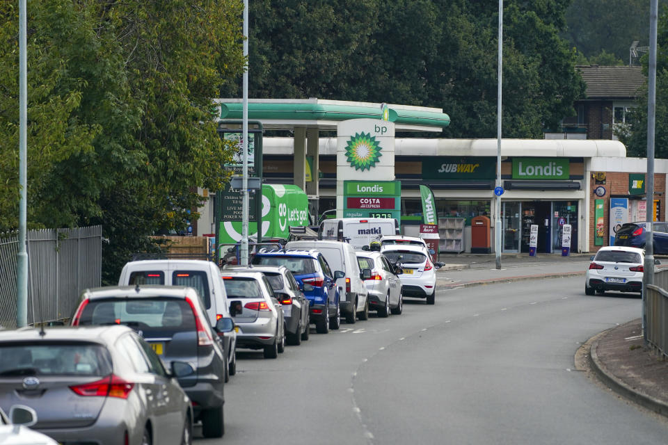 Cars queue for fuel at a BP petrol station in Bracknell, Berkshire. Picture date: Sunday September 26, 2021.