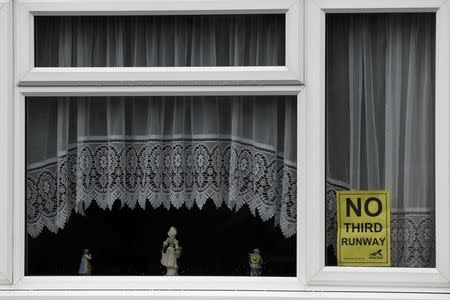 An anti-Heathrow airport expansion poster is seen in the village of Harmondsworth, very close to the proposed site of the airport's third runway, near London, Britain February 2, 2017. REUTERS/Stefan Wermuth