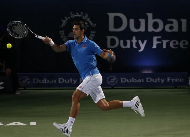 World No1 Novak Djokovic returns the ball en route to victory against Andrey Golubev.