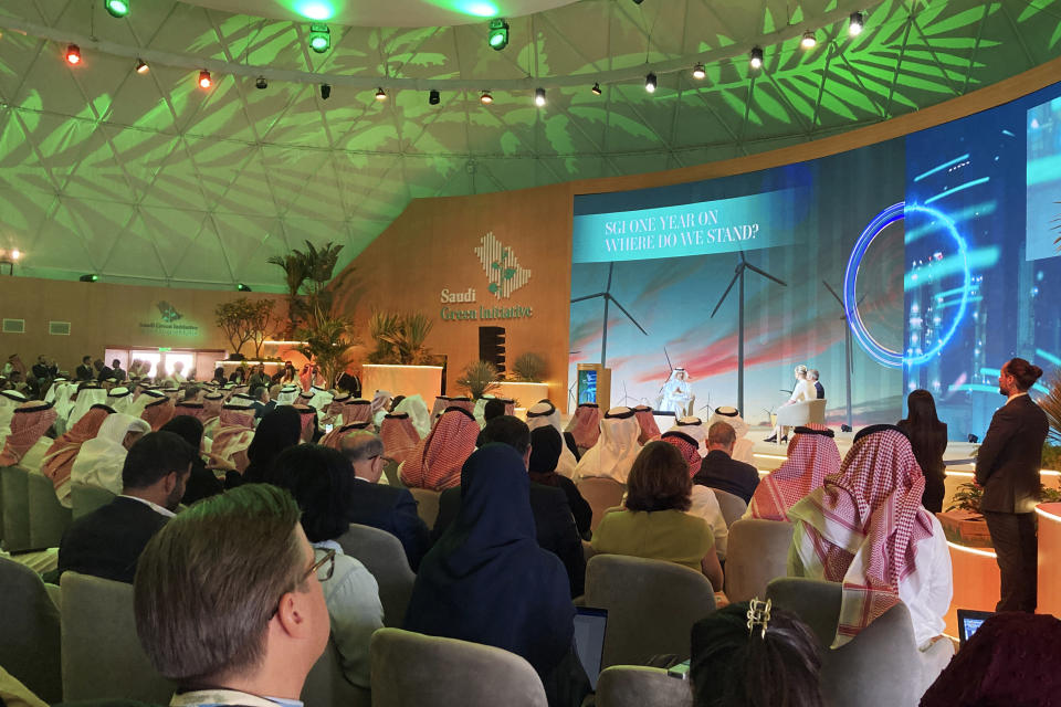 Attendees listen to Prince Abdulaziz bin Salman al Saud, Saudi Arabia's energy minister, in a session during the Saudi Green Initiative forum near the COP27 climate conference venue, Friday, Nov. 11, 2022, in Sharm el-Sheikh, Egypt. (AP Photo/Kelvin Chan)