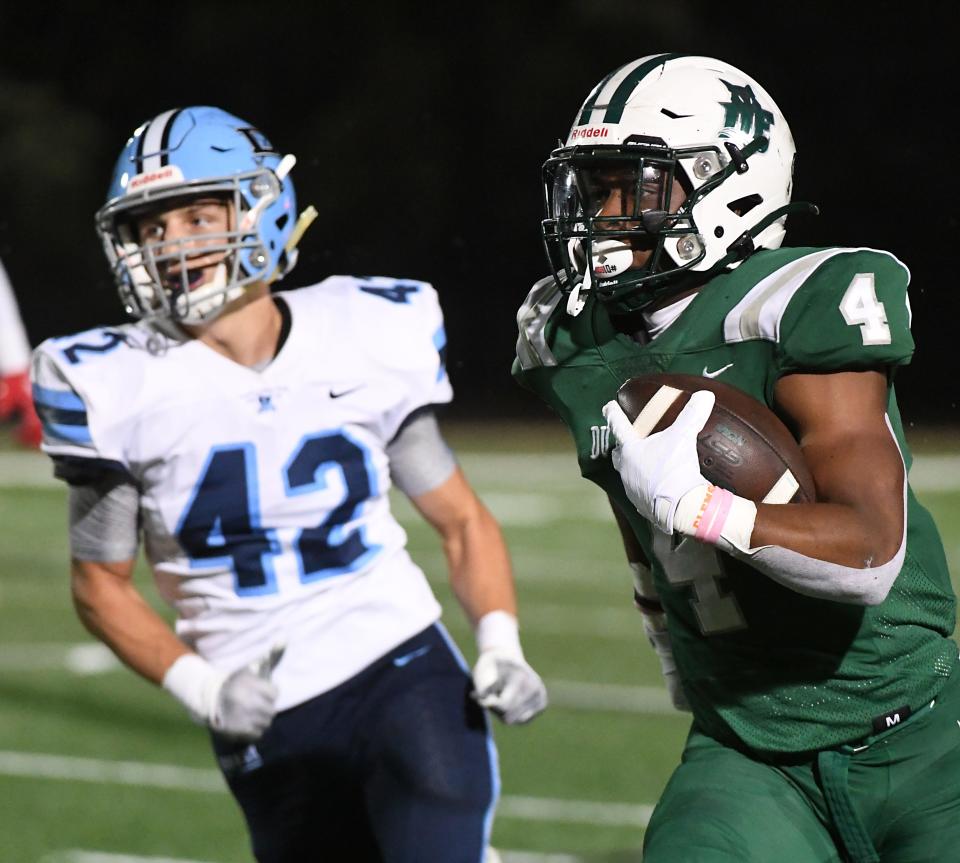 Dutch Fork played Dorman in the second round of the high school football state playoffs at Dutch Fork High School on Nov. 11, 2022. Dorman's Owen Hendricks (42) tries to catch Dutch Fork's Jarvis Green (4) on a play.
