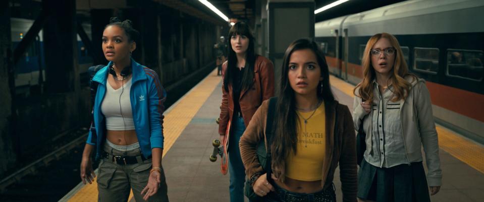 Madame Web characters standing on train platform