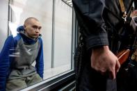 Russian soldier Shishimarin attends a court hearing in Kyiv