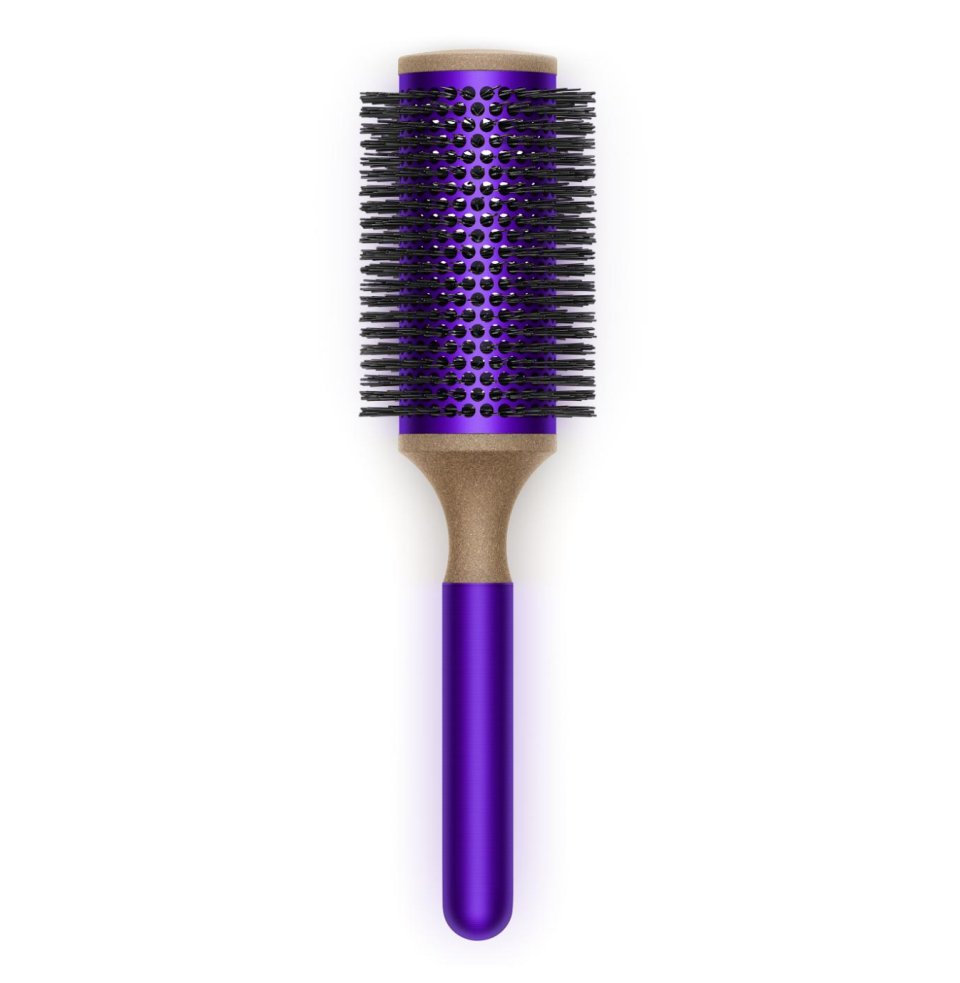 A purple, beige and black round brush on a white background.