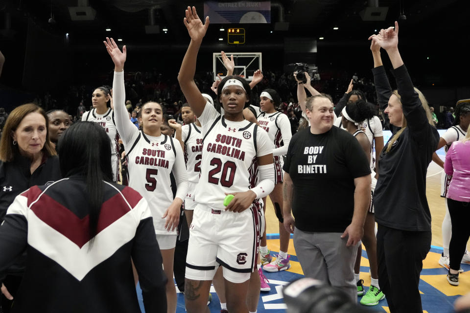 South Carolina players wave to fans after a win over Notre Dame in an NCAA college basketball game Monday, Nov. 6, 2023, in Paris. (AP Photo/Thibault Camus)
