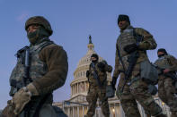 FILE - In this Jan. 19, 2021, file photo National Guard troops reinforce the security zone on Capitol Hill in Washington. Over the past year, National Guard members have been called in to battle the COVID-19 pandemic, natural disasters and race riots. (AP Photo/J. Scott Applewhite, File)