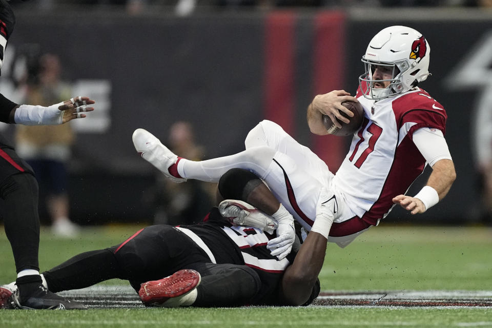 Atlanta Falcons defensive end Grady Jarrett (97) hits Arizona Cardinals quarterback David Blough (17) during the first half of an NFL football game, Sunday, Jan. 1, 2023, in Atlanta. (AP Photo/John Bazemore)