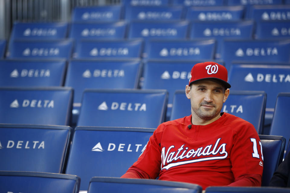 FILE - In this Oct. 18, 2019, file photo, Washington Nationals first baseman Ryan Zimmerman sits in the stands as he participates in a television interview after a baseball workout in Washington. Zimmerman is offering his thoughts as told to AP in a diary of sorts while waiting for the 2020 season to begin. (AP Photo/Patrick Semansky, File)