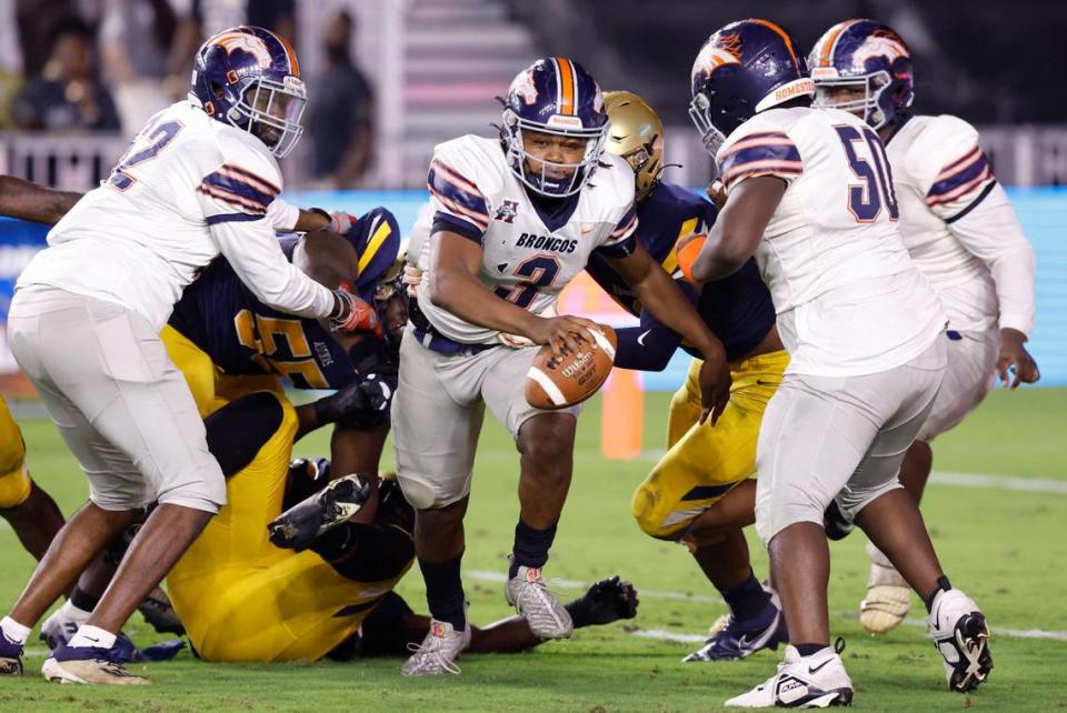 Homestead Broncos quarterback Joshua Townsend (3) scrambles as St. Thomas Aquinas defends in the first quarter during the Class 3M state championship game at DRV PNK Stadium in Ft. Lauderdale on Thursday, December 15, 2022.