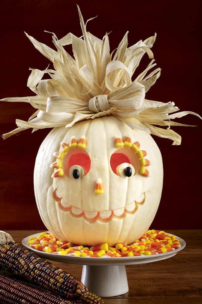 <p>With some light carving, a creative hairpiece fashioned from corn husks, some glue and a bag or two of candy corn, this friendly Jack-o-Lantern might be the friendliest one on the block.</p>