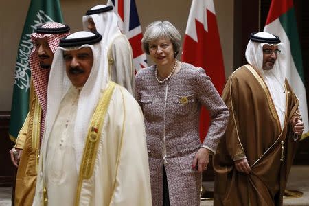 Britain's Prime Minister Theresa May leaves after a family photo with other leaders at the Gulf Cooperation Council (GCC) Summit in Manama, Bahrain December 7, 2016. REUTERS/Stefan Wermuth