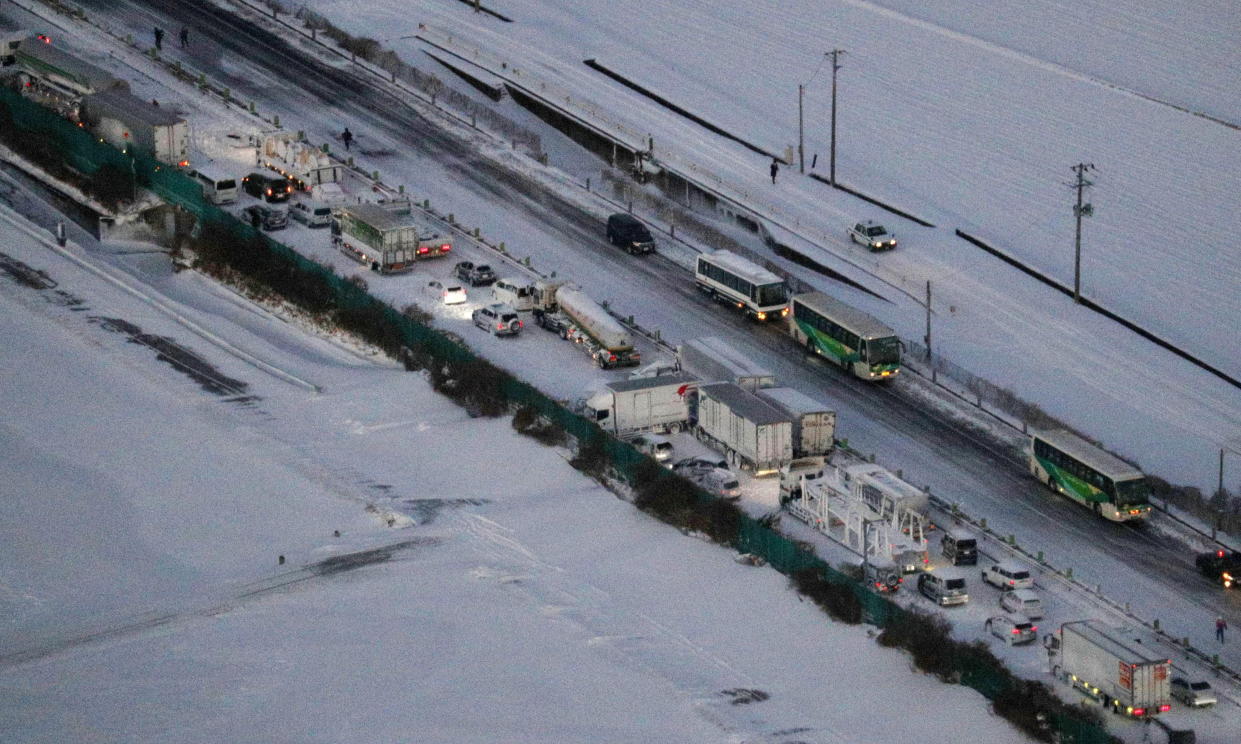 An aerial view shows the site where cars were involved in a series of crashes when a snow storm struck a stretch of highway on the Tohoku Expressway in Osaki, Miyagi prefecture, northern Japan January 19, 2021. Kyodo via REUTERS ATTENTION EDITORS - THIS IMAGE WAS PROVIDED BY A THIRD PARTY. MANDATORY CREDIT. JAPAN OUT. NO COMMERCIAL OR EDITORIAL SALES IN JAPAN.