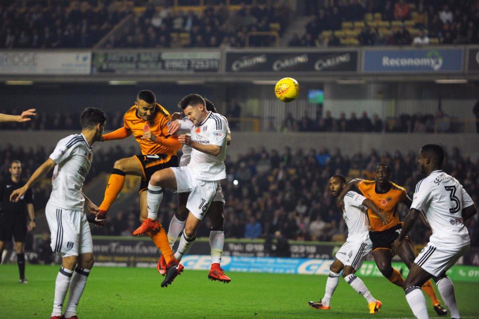 Wolves defender Romain Saiss heads his side into an early lead: Getty Images