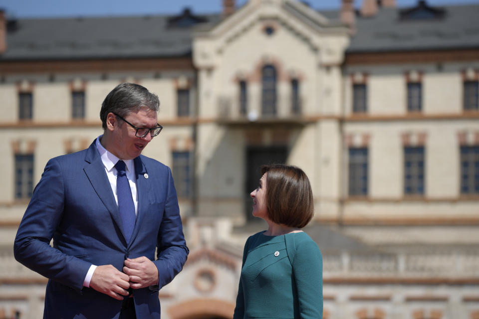 Moldova's President Maia Sandu, right, greets Serbia's President Aleksandar Vucic during arrivals for the European Political Community Summit at the Mimi Castle in Bulboaca, Moldova, Thursday, June 1, 2023. Leaders are meeting in Moldova Thursday for a summit aiming to show a united front in the face of Russia's war in Ukraine and underscore support for the Eastern European country's ambitions to draw closer to the West and keep Moscow at bay. (AP Photo/Andreea Alexandru)