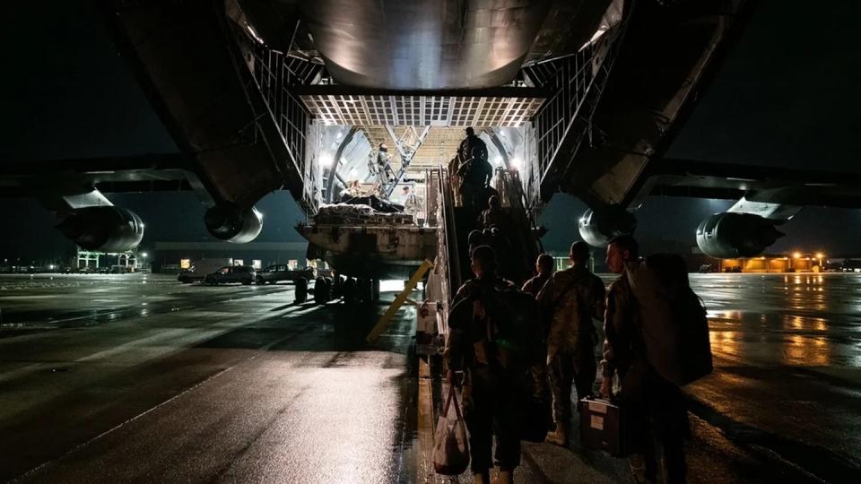 The 628th Air Base Wing and 437th Airlift Wing from Joint Base Charleston, S.C., prepare to depart for Guam on a C-5 Galaxy July 5 as part of the Mobility Guardian exercise. (Tech. Sgt. James Cason/Air Force)