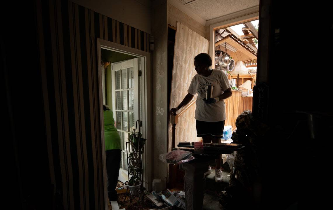 Evelyn Powell stands in the doorway to her kitchen on Thursday, July 20, 2023. Evelyn and James Powell’s house, situated on 7 Bridges Rd. east of Battleboro, N.C., was hit by the tornado on Wednesday afternoon. James said he was standing in the house watching the news when the roof lifted off the place. The two have lived in the house for over 40 years. Photo by Anna Connors, The News & Observer Anna Connors/Anna Connors, The News & Observer