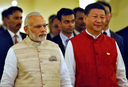 Indian Prime Minister Narendra Modi (L) and Chinese President Xi Jinping arrive for a photo opportunity ahead of BRICS (Brazil, Russia, India, China and South Africa) Summit in Benaulim, in the western state of Goa, India, October 15, 2016. REUTERS/Danish Siddiqui