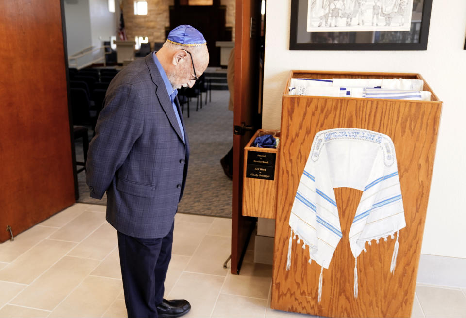 Lawrence Schwartz stands in the lobby of Congregation Beth Israel in Colleyville, Texas, Thursday, April 7, 2022. Three months after an armed captor took Schwartz and three others hostage at the Texas synagogue, the house of worship is reopening. (AP Photo/LM Otero)