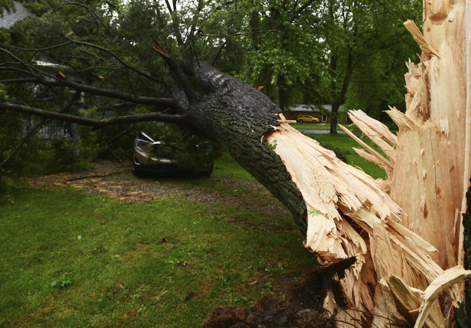 Storm damage is seen at a home on Main Street in Concord, Mich., on Wednesday, June 10, 2020. Strong storms with heavy winds swept across Jackson County causing power outages, downing trees and damaging property. (J. Scott Park/Jackson Citizen Patriot via AP)