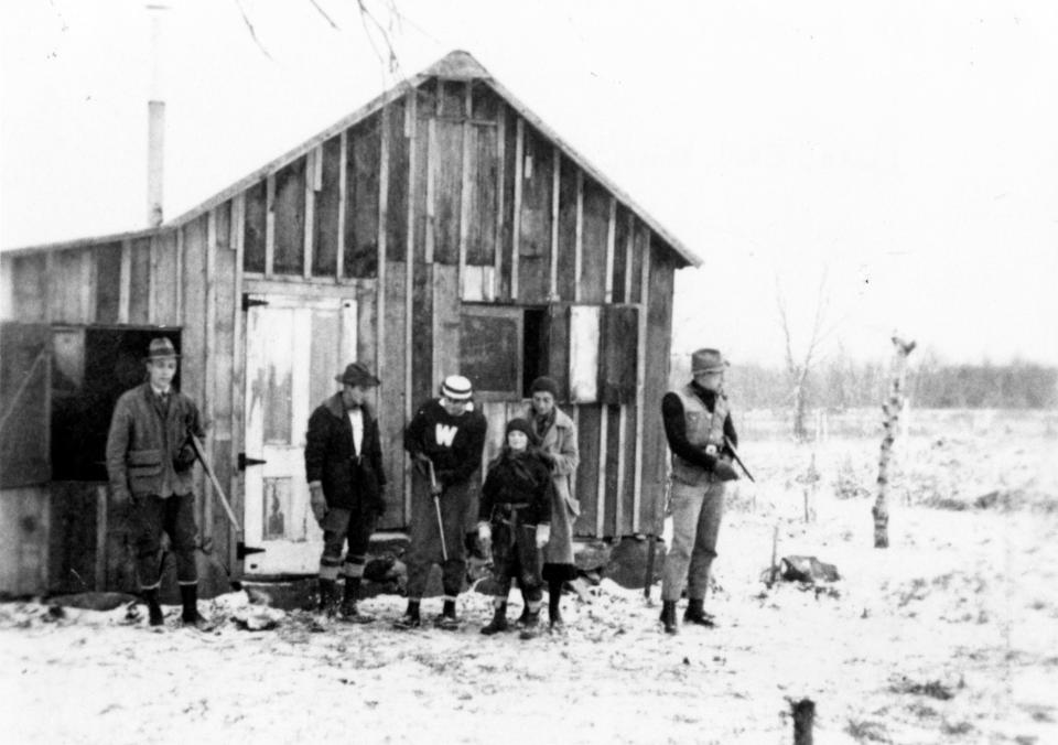 Aldo Leopold, right, and members of his family prepare to go hunting in 1935 at the "Shack" near Baraboo, Wisconsin.