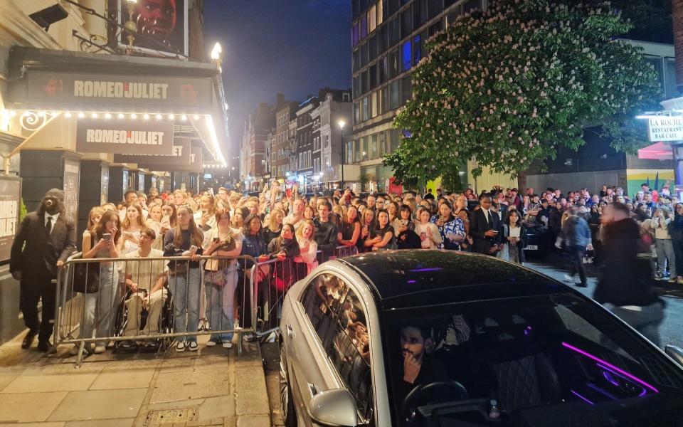 Social media videos show a casually dressed Holland leaving the stage door and spending about 10 seconds waving to crowds