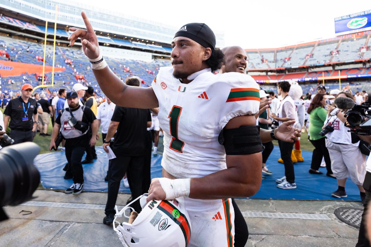 Aug 31, 2024; Gainesville, Florida, USA; Miami Hurricanes quarterback Cam Ward (1) reacts after a game against the Florida Gators at Ben Hill Griffin Stadium. Mandatory Credit: Matt Pendleton-USA TODAY Sports