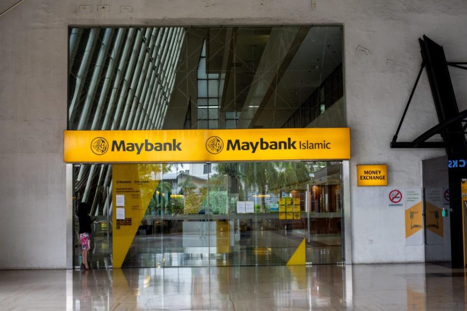 Signage atop an entrance to Malayan Banking Bhd. (Maybank) and Maybank Islamic Bhd. bank branch in Kuala Lumpur, Malaysia, on Tuesday, May 21, 2024. Maybank, Malaysia's largest lender, is scheduled to release earnings on May 24. Photographer: KG Krishnan/Bloomberg via Getty Images