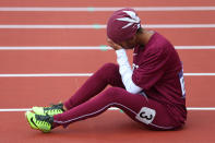 LONDON, ENGLAND - AUGUST 03: Noor Hussain Al-Malki of Qatar pulls up injured in the Women's 100m Heats on Day 7 of the London 2012 Olympic Games at Olympic Stadium on August 3, 2012 in London, England. (Photo by Alexander Hassenstein/Getty Images)