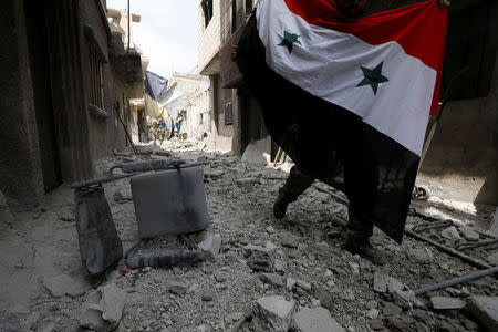 Soldiers loyal to Syria's President Bashar al-Assad forces are deployed at al-Qadam area near Yarmouk Palestinian camp in Damascus,Syria April 29,2018.REUTERS/ Omar Sanadiki