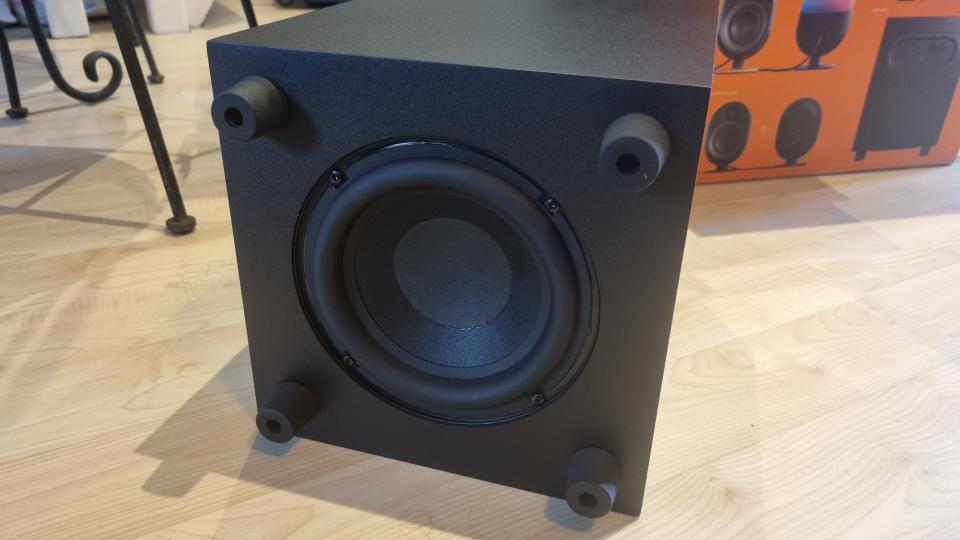 The underside of the subwoofer of the SteelSeries Arena 9 5.1 speakers, showing the large 6.5 inch driver