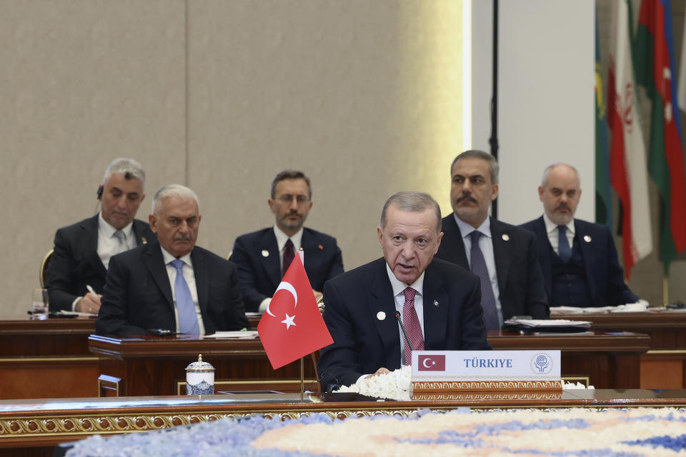 In this handout photo released by Turkish Presidency, Turkey's President Recep Tayyip Erdogan talks during a meeting of the 10-member Economic Cooperation Organization in Tashkent, Uzbekistan, Thursday, Nov. 9, 2023. (Turkish Presidency via AP)