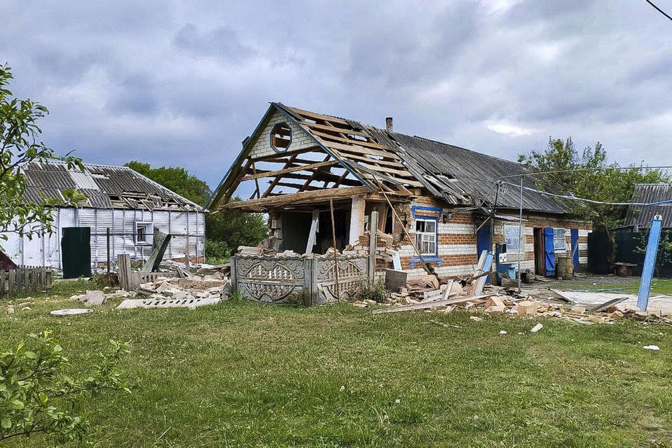 This handout photo released by Belgorod region governor Vyacheslav Gladkov's telegram channel on Tuesday, May 23, 2023, shows damaged houses in Russia's western Belgorod region on Tuesday, May 23, 2023. Russian troops and security forces fought for a second day Tuesday against an alleged cross-border raid that Moscow blamed on Ukrainian military saboteurs but which Kyiv portrayed as an uprising against the Kremlin by Russian partisans. Vyacheslav Gladkov, governor of the Belgorod region on the Ukraine border, said forces continued to sweep the rural area around the town of Graivoron, where the alleged attack on Monday took place. (Belgorod region governor Vyacheslav Gladkov telegram channel via AP)
