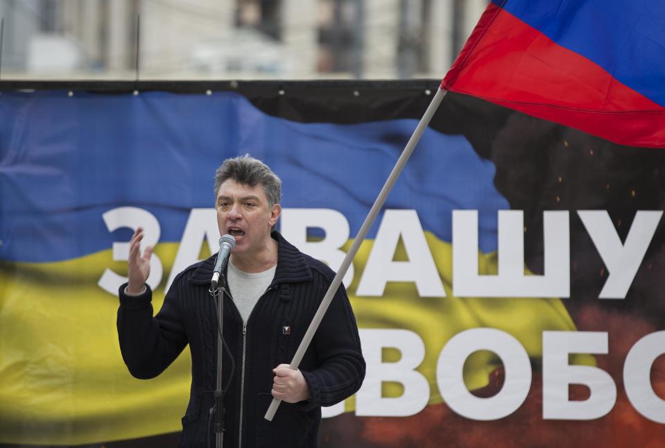 Boris Nemtsov, a former Russian deputy prime minister and opposition leader addresses demonstrators during a massive rally to oppose president Vladimir Putin's policies in Ukraine, in Moscow, Saturday, March 15, 2014. Large rival marches have taken place in Moscow over Kremlin-backed plans for Ukraine’s province of Crimea to break away and merge with Russia. More than 10,000 people turned out Saturday for a rally in the center of the city held to oppose what many demonstrators described as Russia’s invasion of the Crimean Peninsula. In a nearby location, a similar sized crowd voiced its support for Crimea’s ethnic Russian majority, who Moscow insists is at threat from an aggressively nationalist leadership now running Ukraine. (AP Photo/Alexander Zemlianichenko)