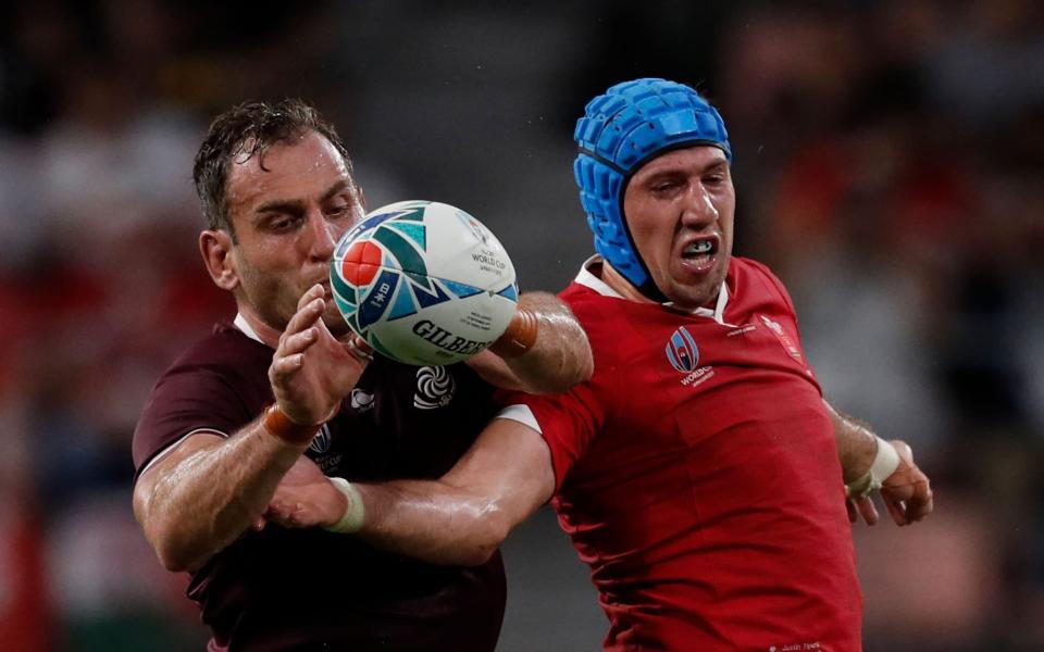 Georgia's lock Giorgi Nemsadze (L) and Wales' flanker Justin Tipuric jump for the ball in a line out during the Japan -  Adrian DENNIS/AFP