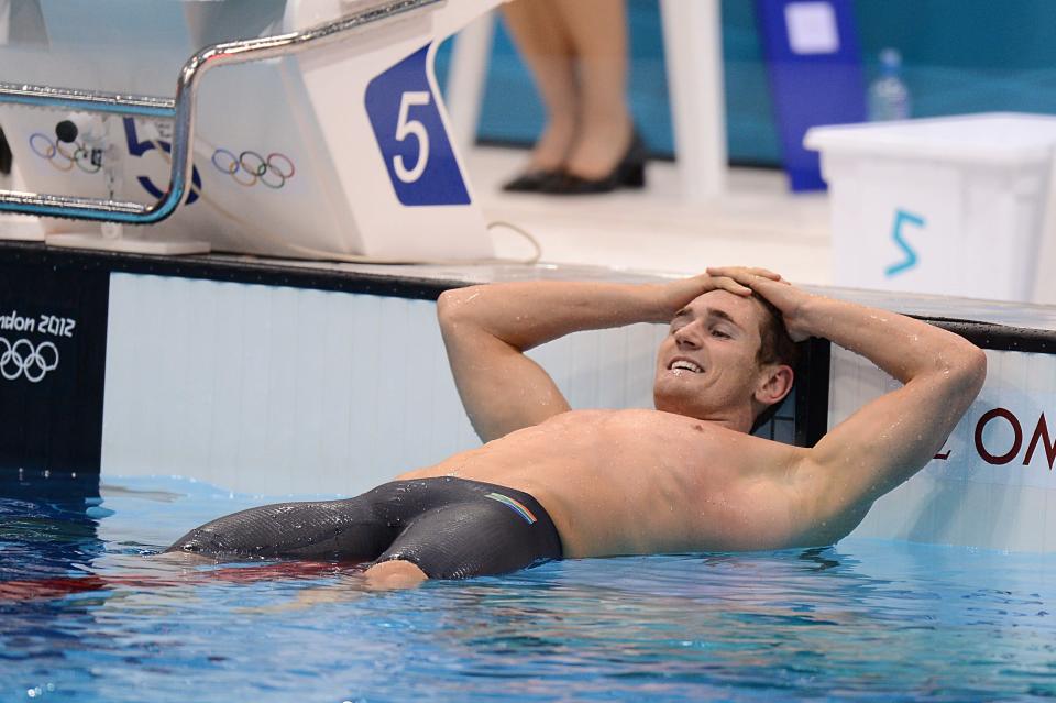 South Africa's Cameron van der Burgh celebrates winning gold in the Men's 100m Breaststroke Final at the Aquatics Centre, London.. 