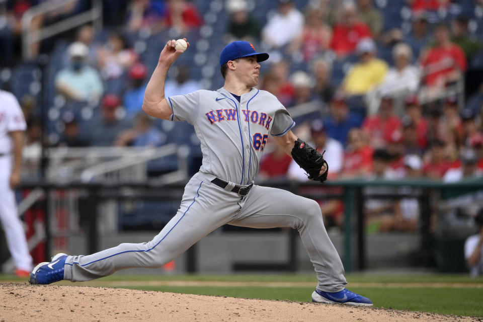 New York Mets relief pitcher Trevor May (65) delivers a pitch during the seventh inning of the first baseball game of a doubleheader against the Washington Nationals, Saturday, June 19, 2021, in Washington. The Mets won 5-1. (AP Photo/Nick Wass)