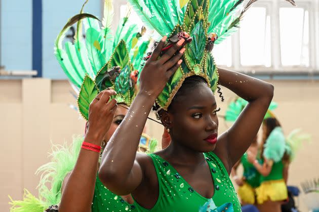 Dancers at the Paraiso School of Samba prepare to join the Notting Hill Carnival parade. (Photo: Clara Watt for HuffPost)