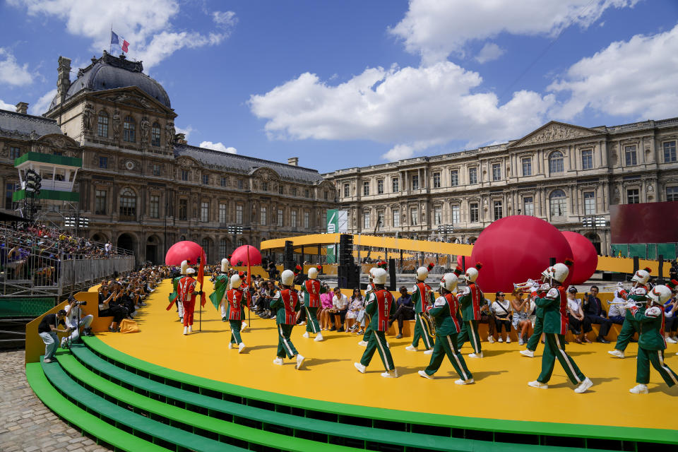 CORRECTS DATE A marching band performs as part of the Louis Vuitton men's Spring Summer 2023 collection presented in Paris, France, Thursday, June 23, 2022. (AP Photo/Francois Mori)