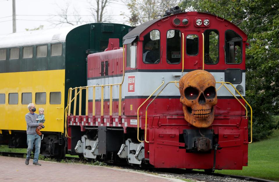 A train takes families to a pumpkin patch at the National Railroad Museum's Great Pumpkin Train event on Oct. 9, 2021, in Green Bay, Wis.