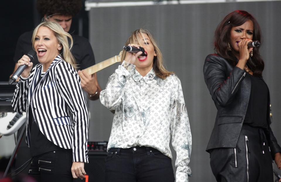 (Left to Right) Nicole Appleton, Melanie Blatt and Shaznay Lewis from All Saints perform on the Virgin Media Stage during the V Festival at Hylands Park in Chelmsford, Essex.