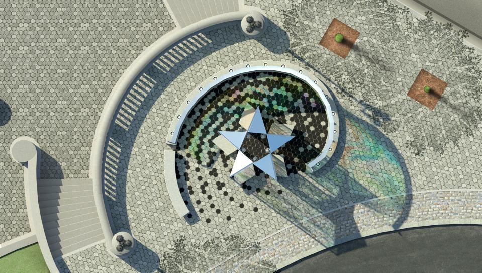 An aerial view of the memorial shows the star of the Puerto Rican flag.