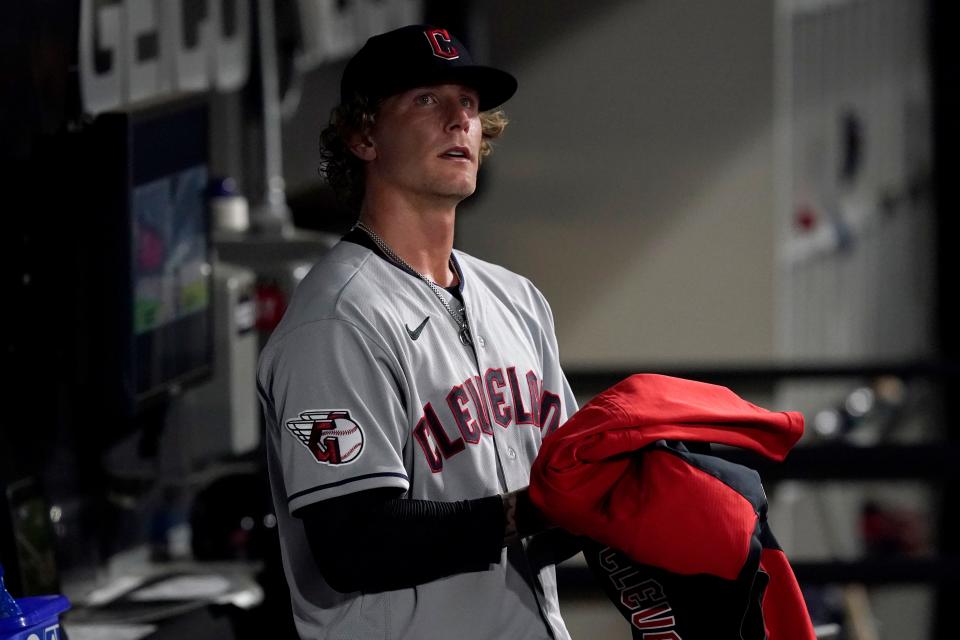 Guardians starting pitcher Zach Plesac looks out from the dugout after being pulled in the seventh inning of Monday night's game against the Chicago White Sox. [Charles Rex Arbogast/Associated Press]