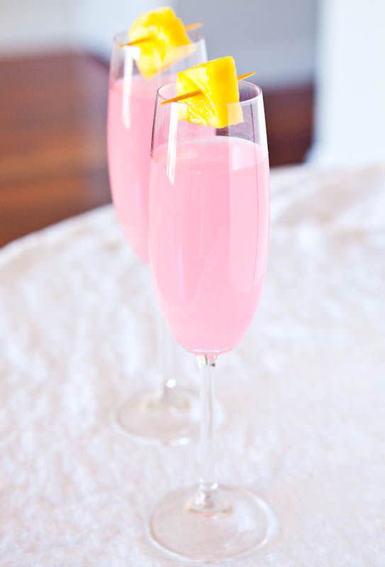 <p>Coconut water gives this pretty in pink cocktail a healthy twist. </p><p>Get the recipe from <a href="http://www.averiecooks.com/2012/04/coconut-water-champagne-fruit-punch.html" rel="nofollow noopener" target="_blank" data-ylk="slk:Averie Cooks;elm:context_link;itc:0;sec:content-canvas" class="link ">Averie Cooks</a>.</p>